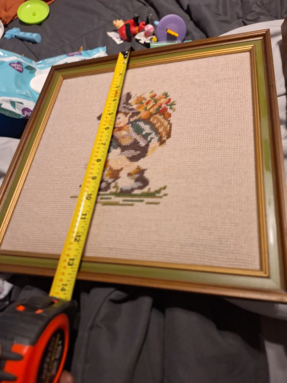 a pair of vintage Hummel framed needlepoint pictures featuring a boy a Girl